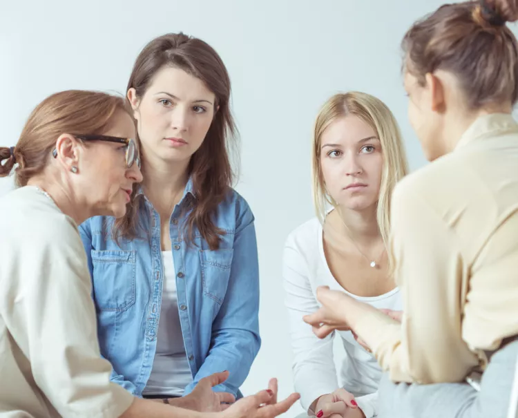 A group of people having a discussion for healthcare fieldwork services - moderation